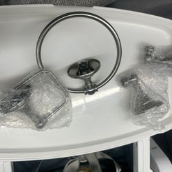 Moen Banbury 3-piece bath accessory kit in a brushed nickel finish.