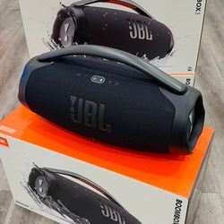 Powerful JBL Boombox 3 portable speaker in black. This waterproof bluetooth speaker has a sturdy metal handle with silicone grips and a durable fabric