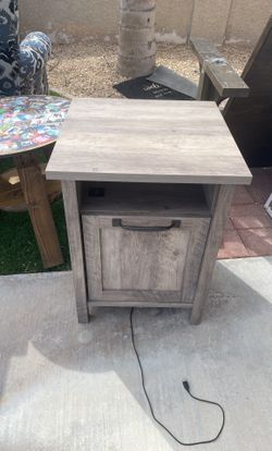 Small bedside table with working charger outlets
