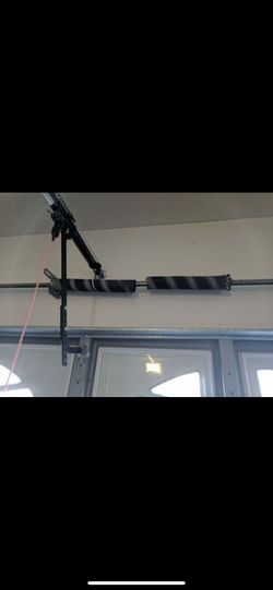 Tension spring garage door