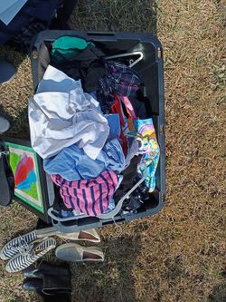 Bin Of Women's Clothes And Bags