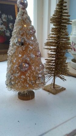 Pale vintage pink tree with pink top and other gold tree