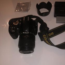Nikon D3100  Digital camera  and holder with Charger and Extra battery works great no problem 