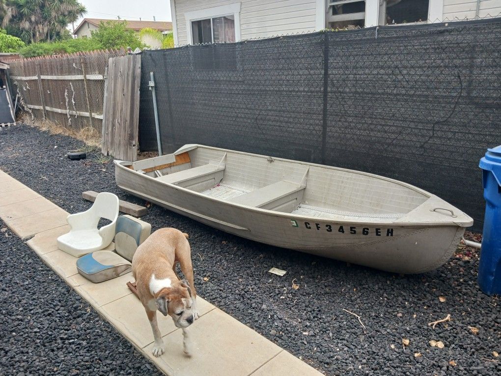 14 ft Sears aluminum boat, with 2 seats.