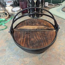 traditional Japanese cast iron pot, often referred to as a sukiyaki pot or irori pot