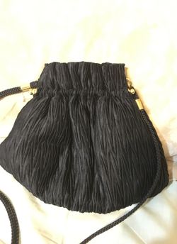 Small black pleated crossbody bag