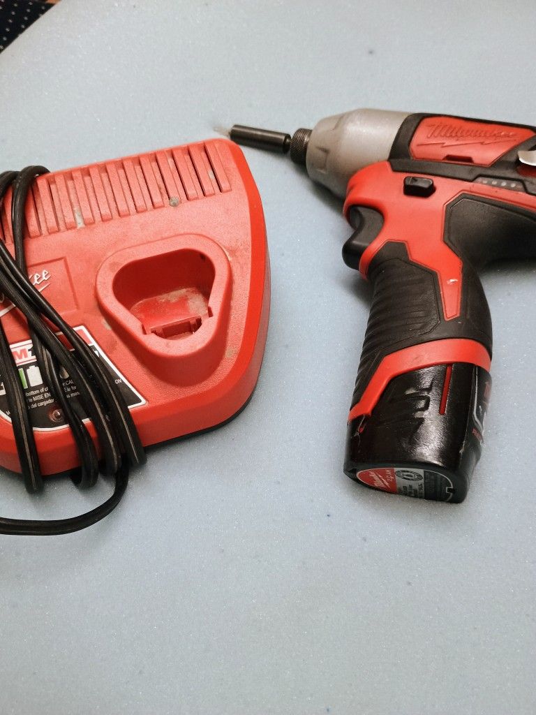 Milwaukee Impact Drill /Charger And Battery