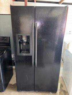 Black GE Refrigerator And Freezer
