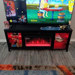 Tv stand fire place. Electric heater. $80