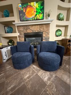 Beautiful set of two blue swivel accent chairs in excellent conditions