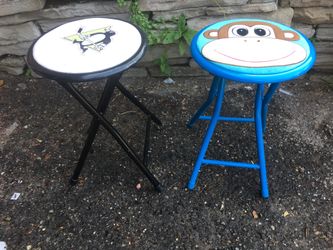 Two Small folding chairs blue and black .