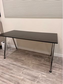 Large black desk with silver legs