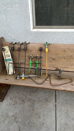 11 Rainbird sprinklers. +3 extra rain bird. sprinkler heads $85 take all.