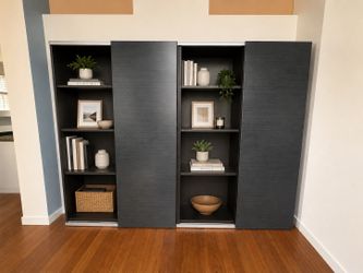 2 bookshelves with sliding doors