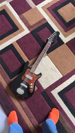 60’s/70’s Unbranded/Sears 3/4 size guitar.