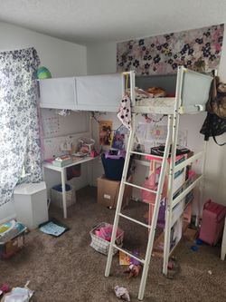Top bunk bed with desk