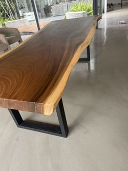 Beautiful custom-made live edge Monkey Pod solid wood dining table.
