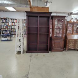 Tall dual-sided bookcase