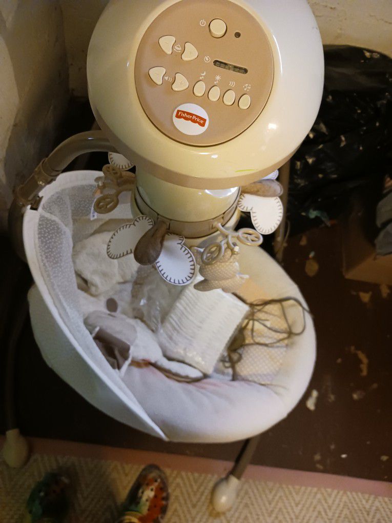 BABY SWING Used Twice Comes With A Pack Of Diapers 