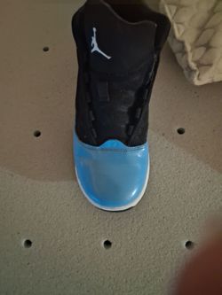 Air Jordan 11 Black and Blue Sneaker