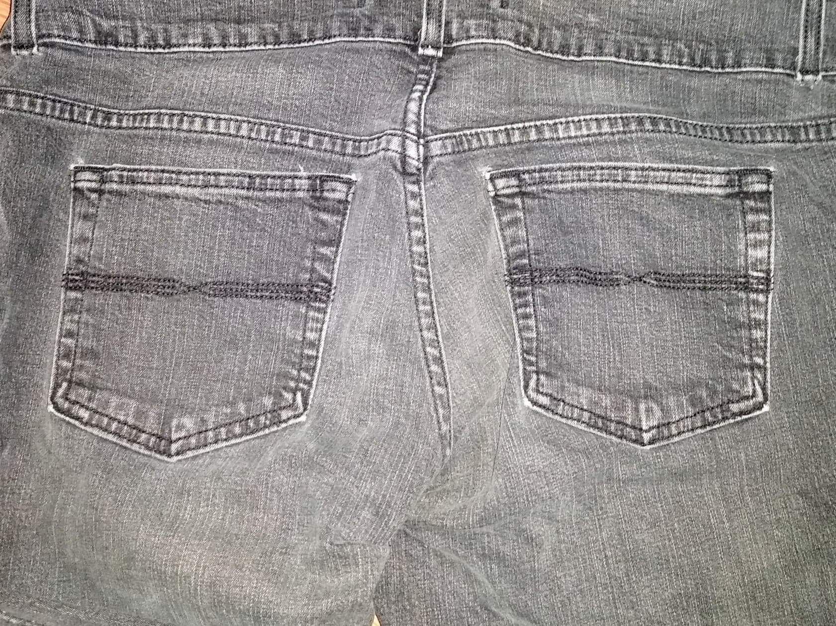 Faded black distressed boot cut jeans size 12R