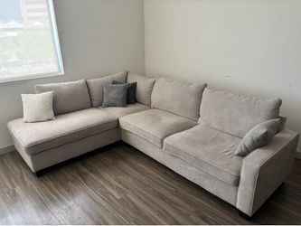 Beige Couch Sectional and Ottoman