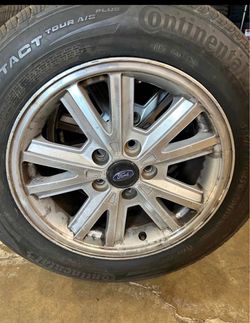 Set of 4 used rims bolt pattern 5X 114.3mm, center bore 70.5 mm, with used tires 205/60/16 $150