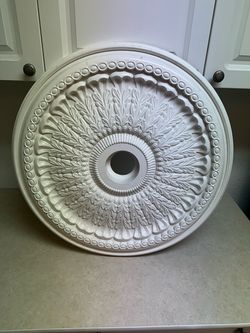 Molded decorative ceiling medallion.