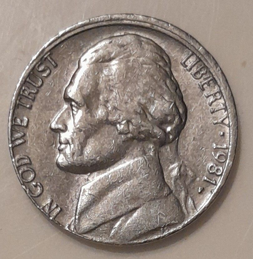 1981 P ERROR NICKEL. TOP SIDE OVERHANGS COIN