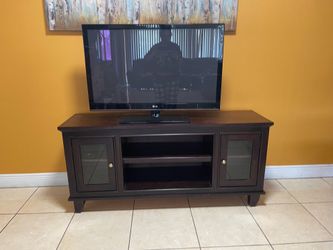 NEED GONE!! DARK WOOD TV STAND!!