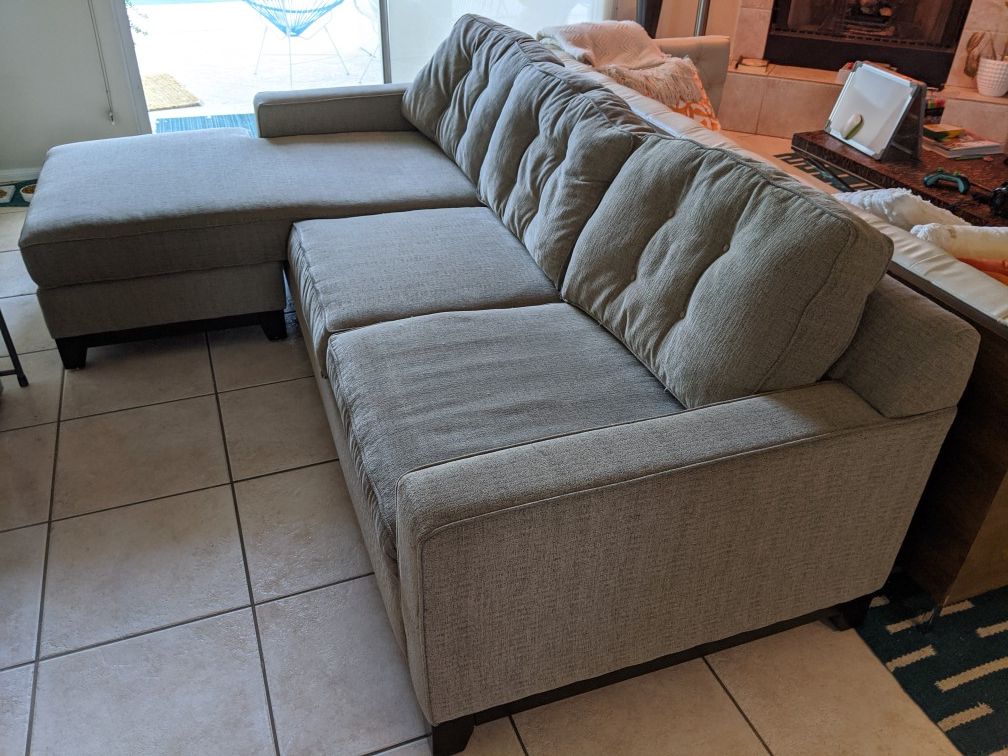Grey sectional couch - ottoman on either side