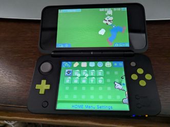 New Nintendo 2DS XL (Black/Lime) CFW + 64 GB + R4 Gold