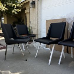Brand New! (Set of 4) Contemporary Leatherette Dining chairs. Retail value over $1200.