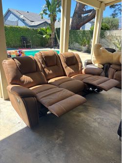 Brown reclining couches