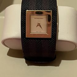 Burberry ladies watch In Gold wide Strap Used 2x
