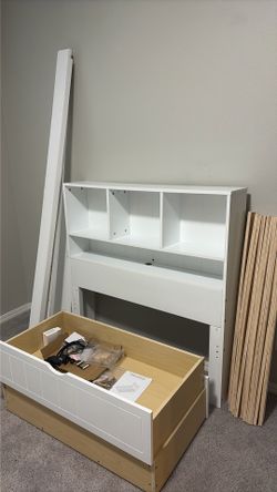 twin-size wooden platform bed in excellent condition.