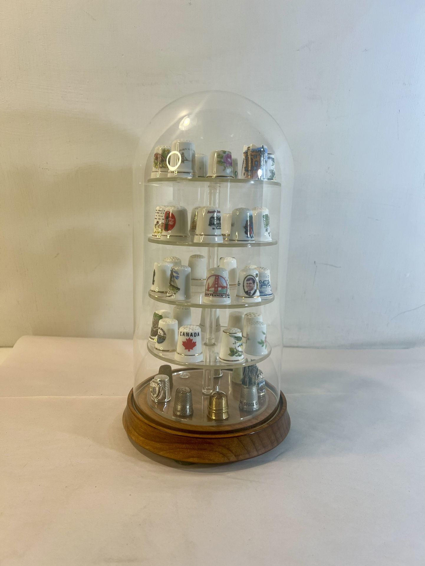 44 Collectable Thimbles (some super rare) in a Glass display case.