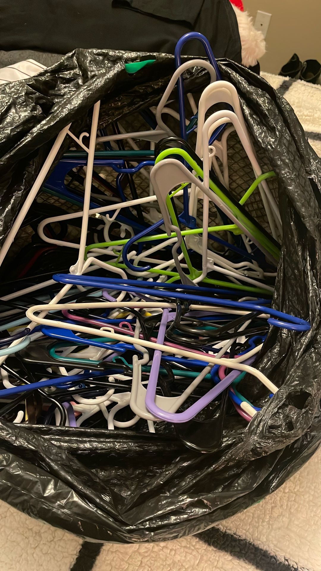 BAG OF PLASTIC HANGERS