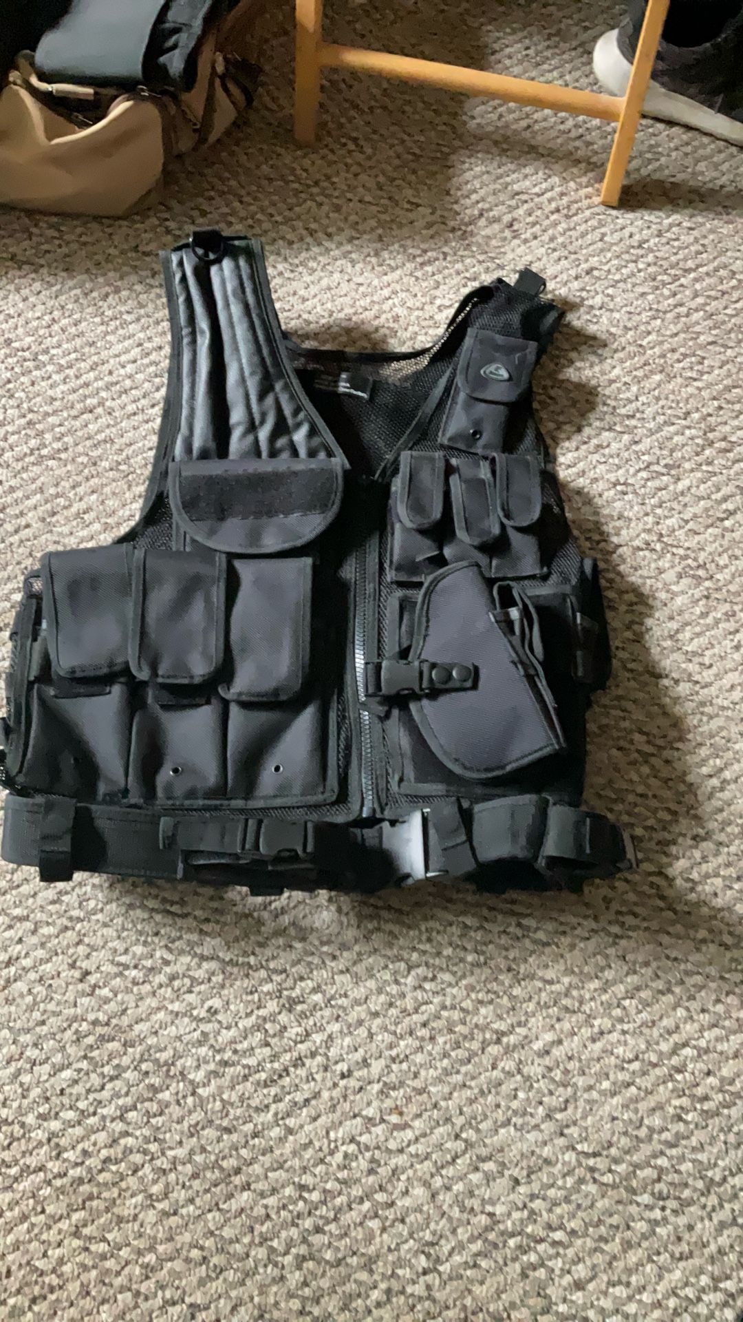 Tactical Vest. AR Rifle Slots. Handgun Holster. Extra Clip Pockets. Very Light Weight And Versatile.