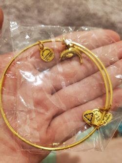 Yellow gold (imitation) Alex and ani bracelet with dolphin charm