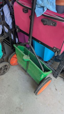 Green Lawn Spreader with Orange Wheels