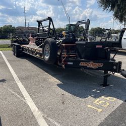 14k Ibs excellent for carrying cars and Heavy Equipment Such as excavators and skid steers and tractors it comes with a tool box and an extra set of r