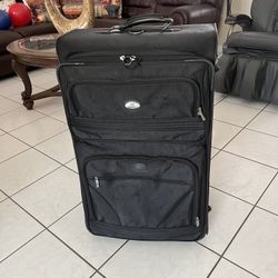 Large two-wheeled suitcase in good condition and clean, measuring 32 inches high, 14 inches wide, and 12 inches deep.
