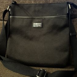 Tommy Hilfiger Women's Chic. Zip closure. Adjustable cross strap.