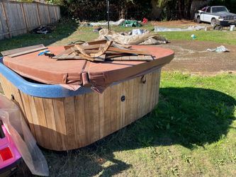 Outdoor Hot Tub with Wood Siding and Cover