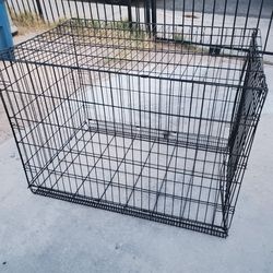 LARGE DOG CAGE 42" LONG X 28" WIDE X 30" TALL (BOTTOM FRONT BENT) SEE PICTURES