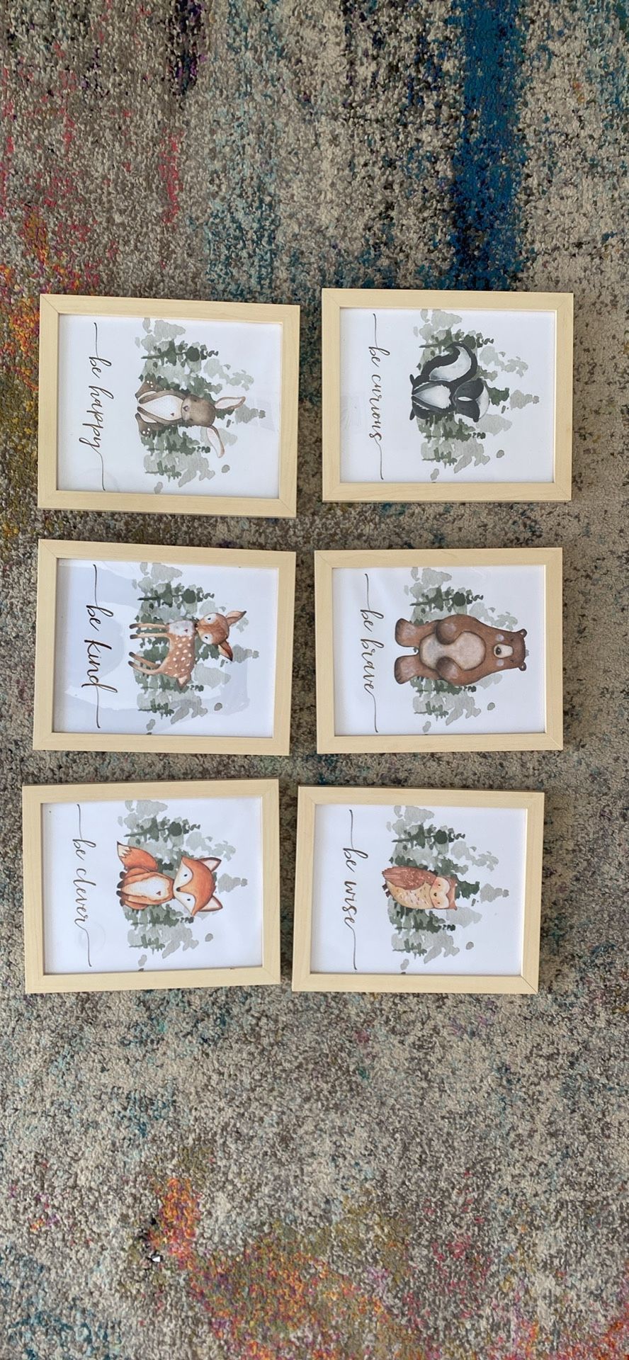 Light wood frames measuring 8x10, featuring animal prints, ideal for a nursery or baby room
