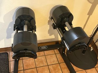 NÜO Dumbbells. 5-80lbs. With stand.
