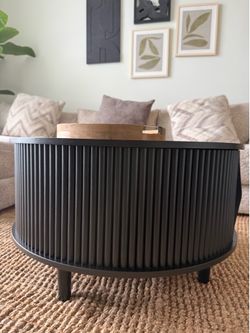 Black Round Coffee Table with Ample Storage