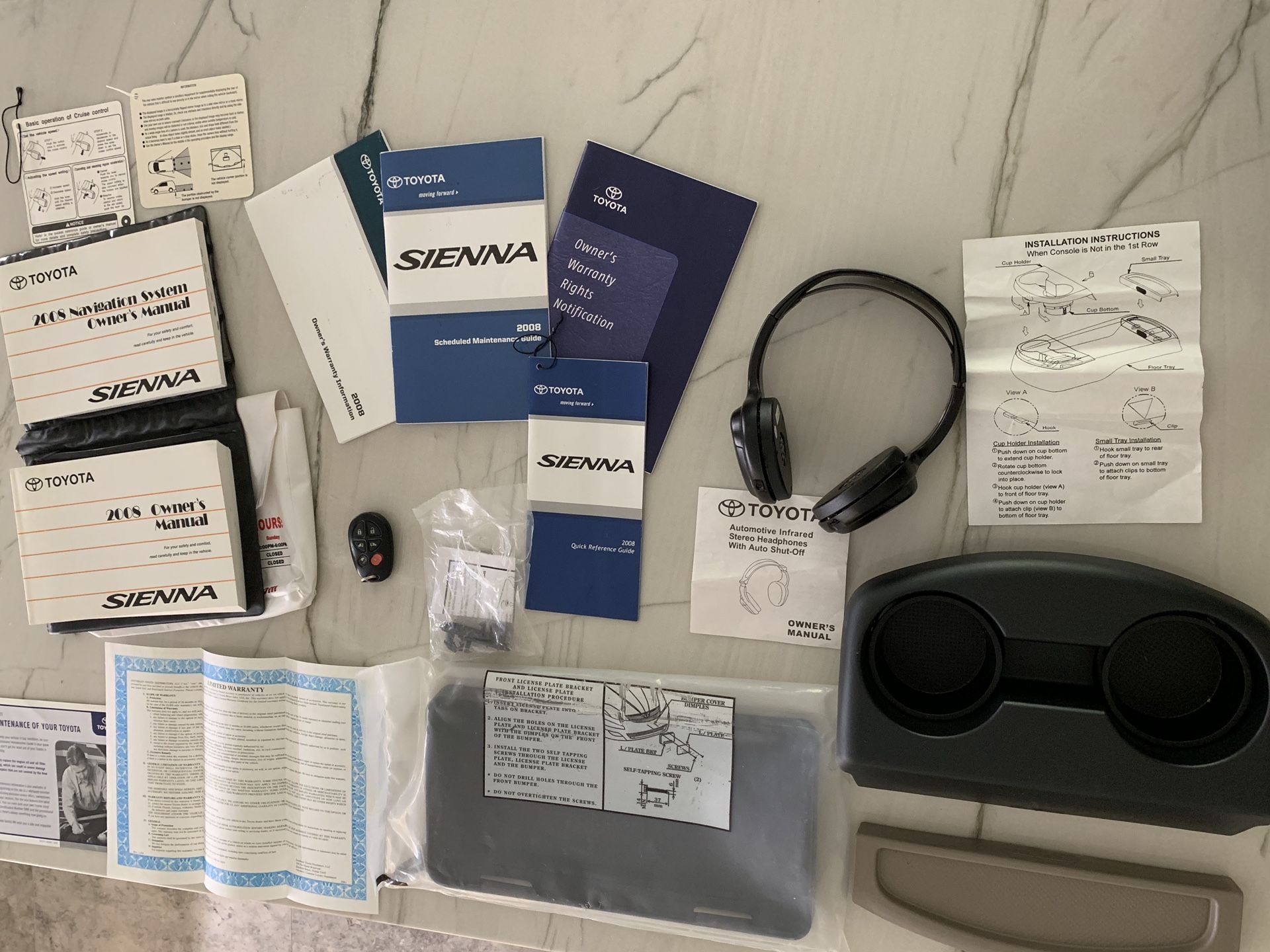 2008 Toyota Sienna owners manuals, OEM key fob, wheel well owner, infrared head phones